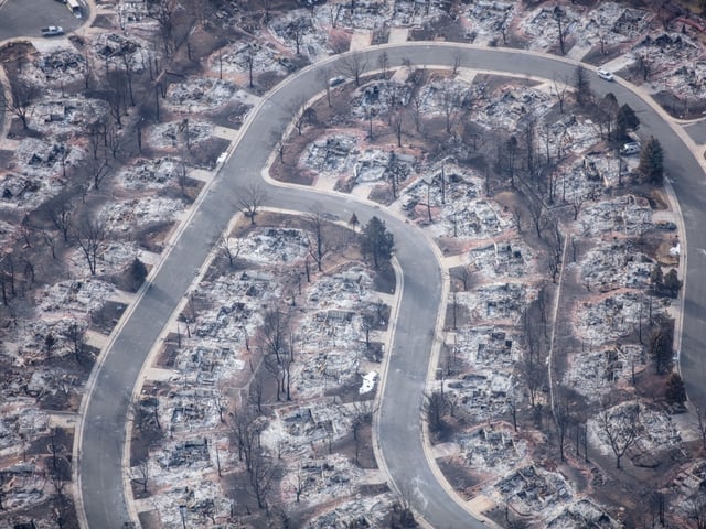 Aerial view of a neighborhood destroyed by wildfire