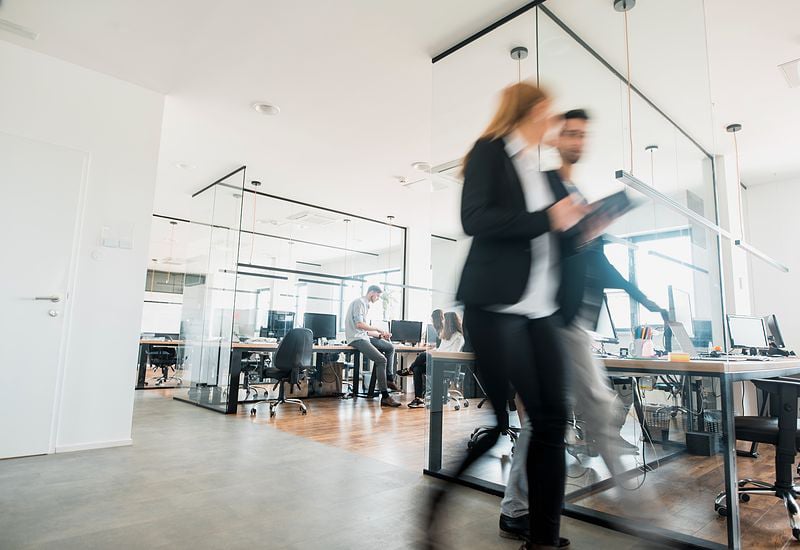 business-colleagues-walking-and-talking-800x550