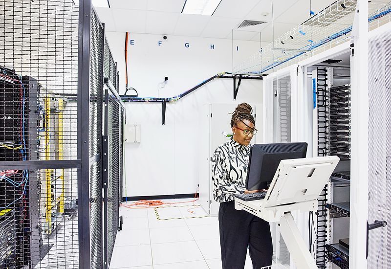 female-computer-engineer-configuring-server-800x550